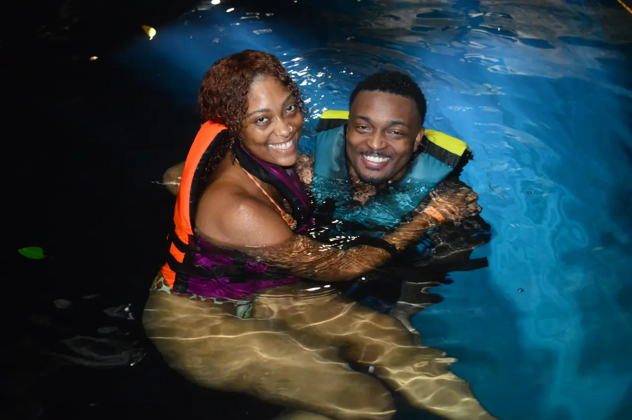 Visitors enjoying the cenote water